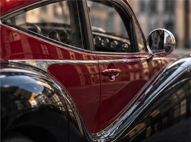 Model O1 red door, curved black fenders and chrome trim